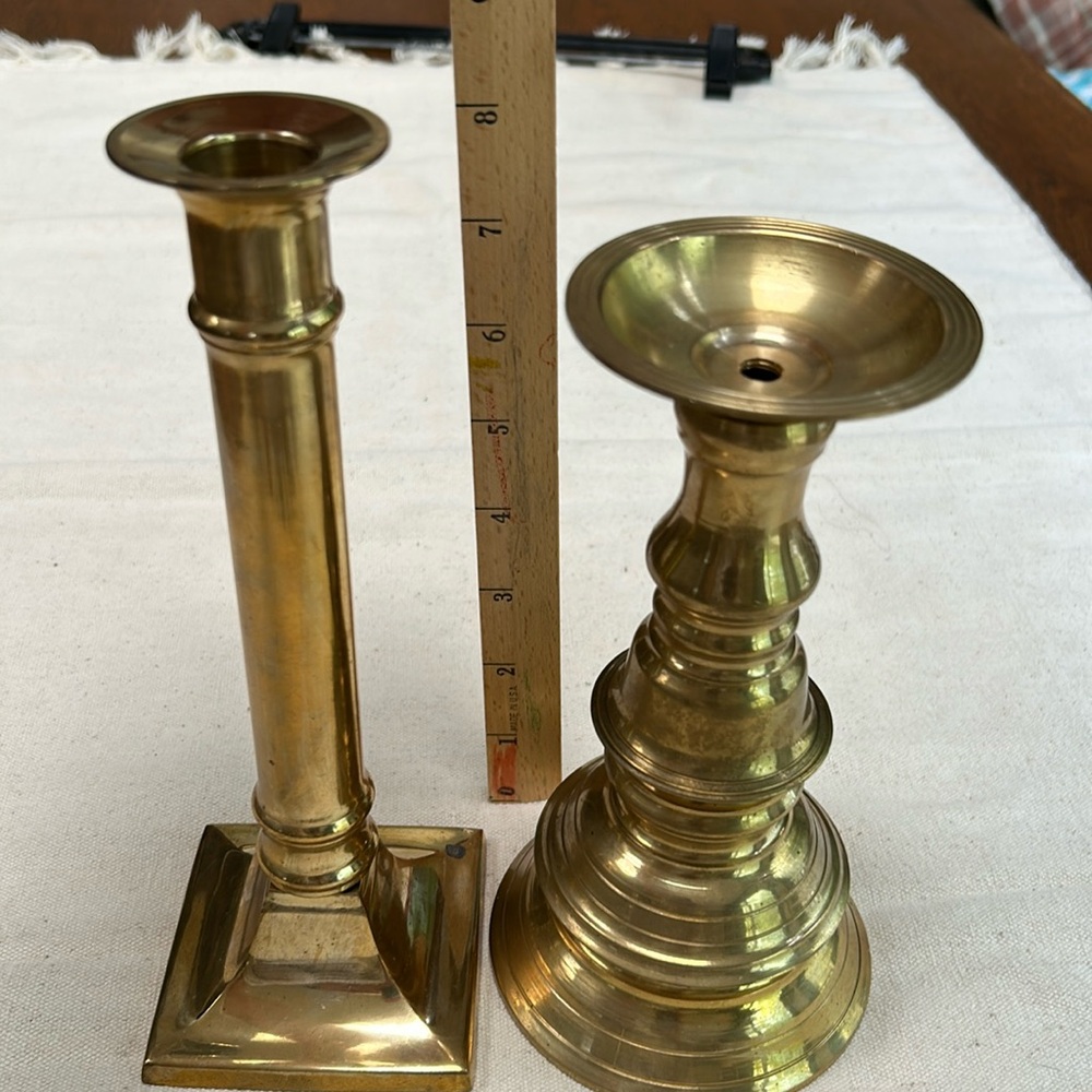 Two brass candlesticks, 7” and 8” tall. No dents- could use some polish